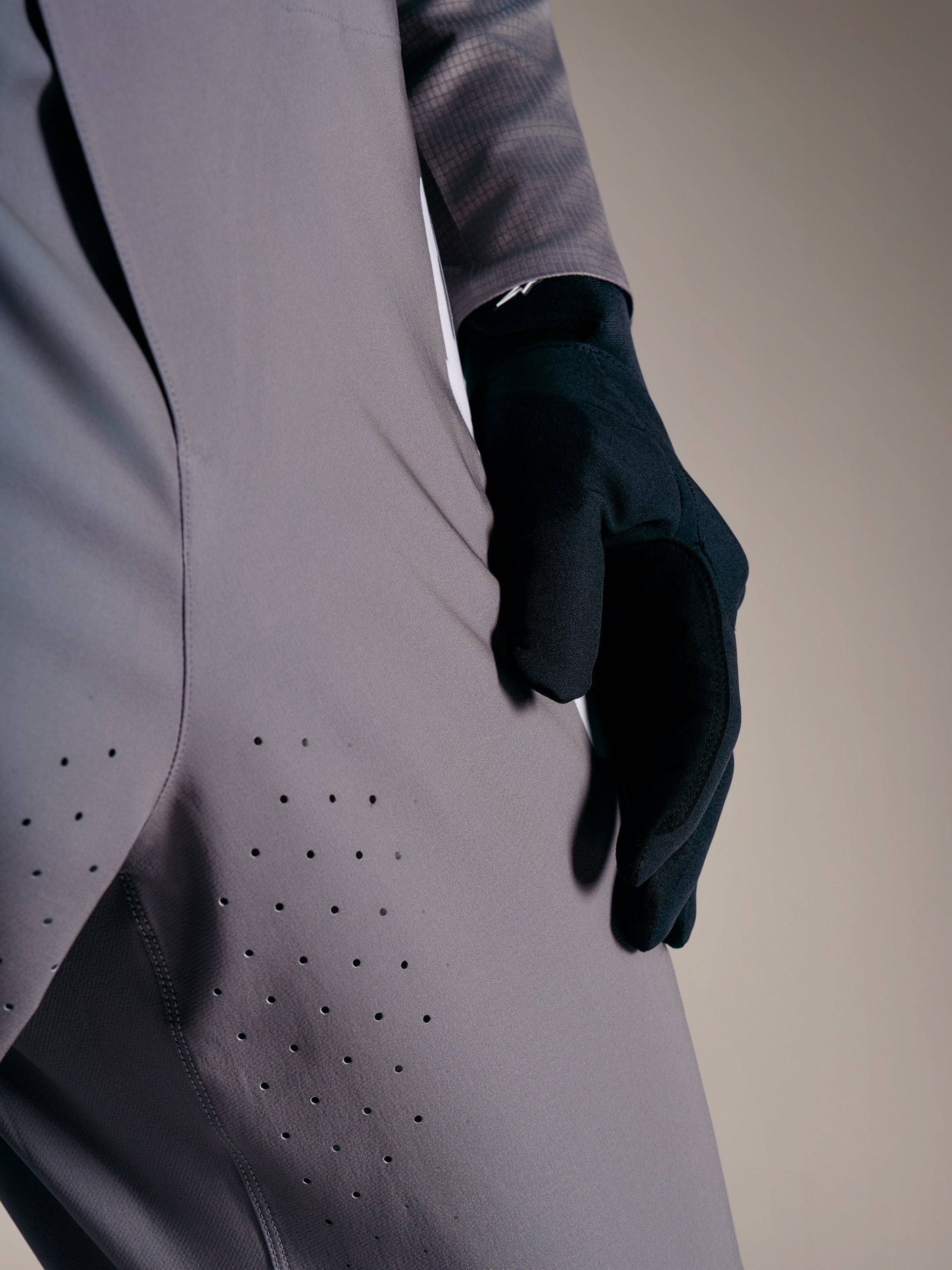 Faded Gray A-Supra Elite Pants featuring laser-cut ventilation holes on the thigh, premium MTB racing apparel.