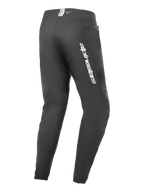 Alpinestars A-Dura Elite Hose, Mountainbike-Hose, Schwarz, seitliche Rückansicht mit silbernem Alpinestars-Branding am Oberschenkel, Reißverschlusstasche und elastischen Bündchen, strapazierfähige technische Ausrüstung für MTB