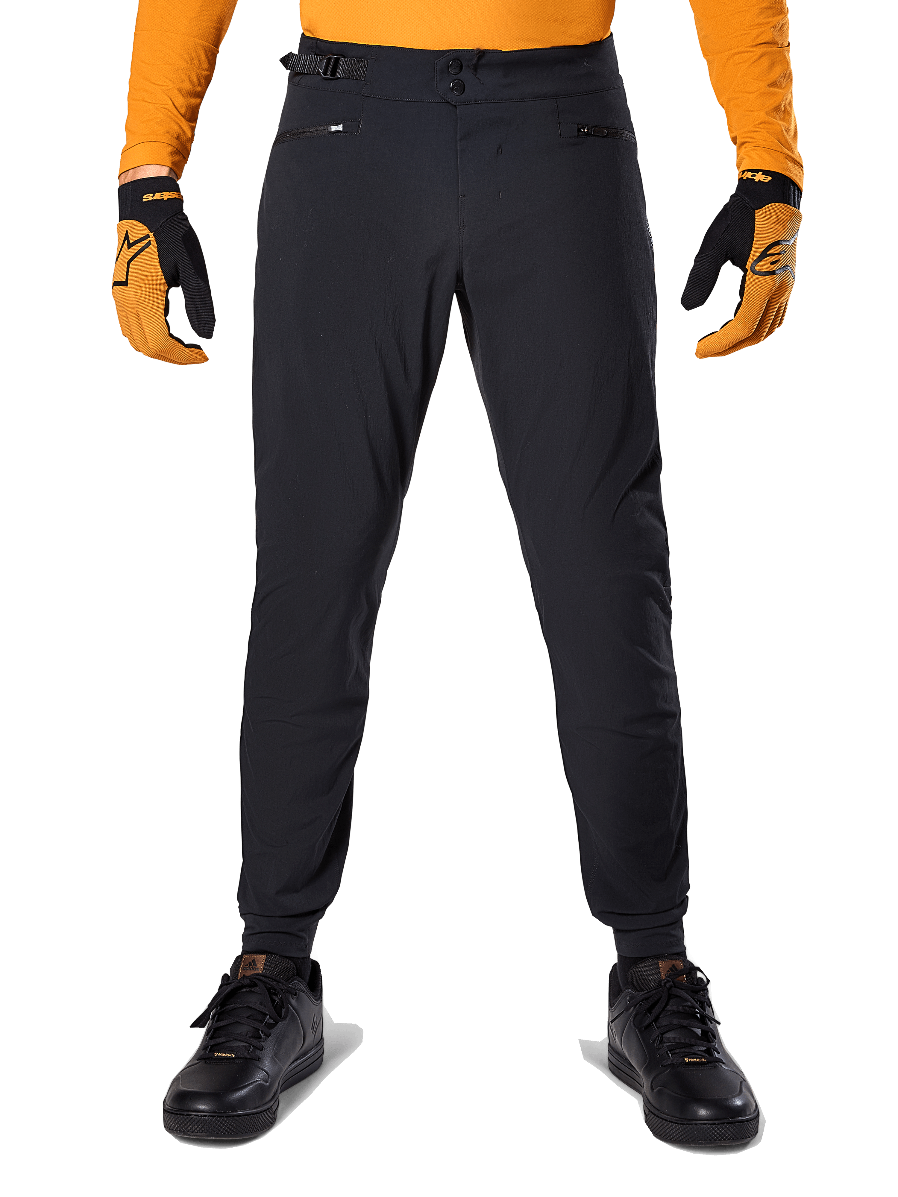 Alpinestars A-Dura Hose, Mountainbike-Hose, Schwarz, kombiniert mit einem orangefarbenen Langarmtrikot und schwarz-orangen Handschuhen, mit doppeltem Druckknopfverschluss und seitlichen Taillenverstellern, strapazierfähiges Textil für den Offroad-Einsatz