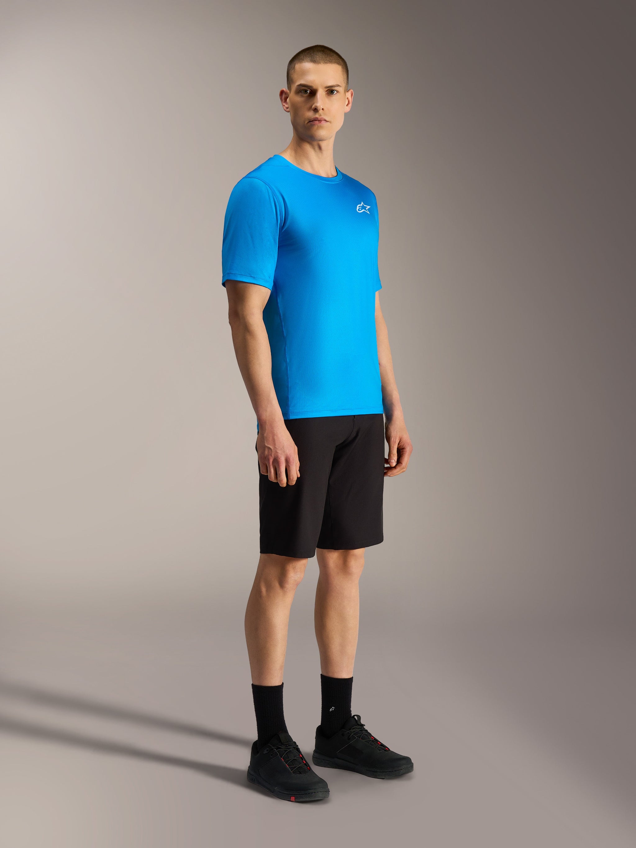 Blue A-Dura Air SS Jersey and black A-Dura Ride Shorts by Alpinestars, high-performance MTB riding gear for men.