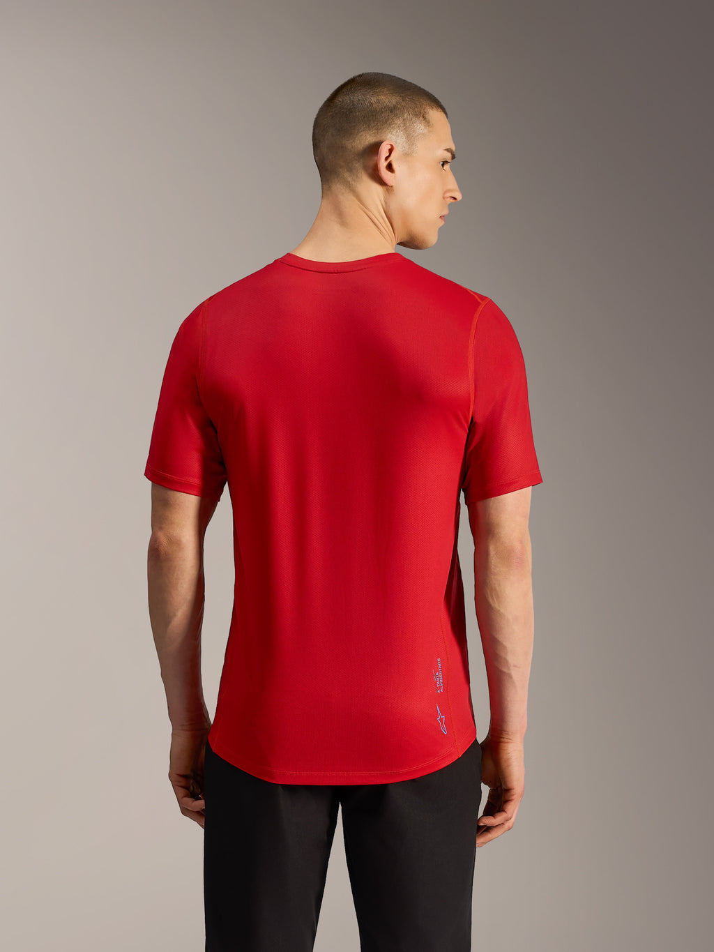 Rotes A-Dura Ride Kurzarm-MTB-Trikot, Rückansicht mit Jacquard-Gewebe, verlängertem Saum und dezentem Branding.