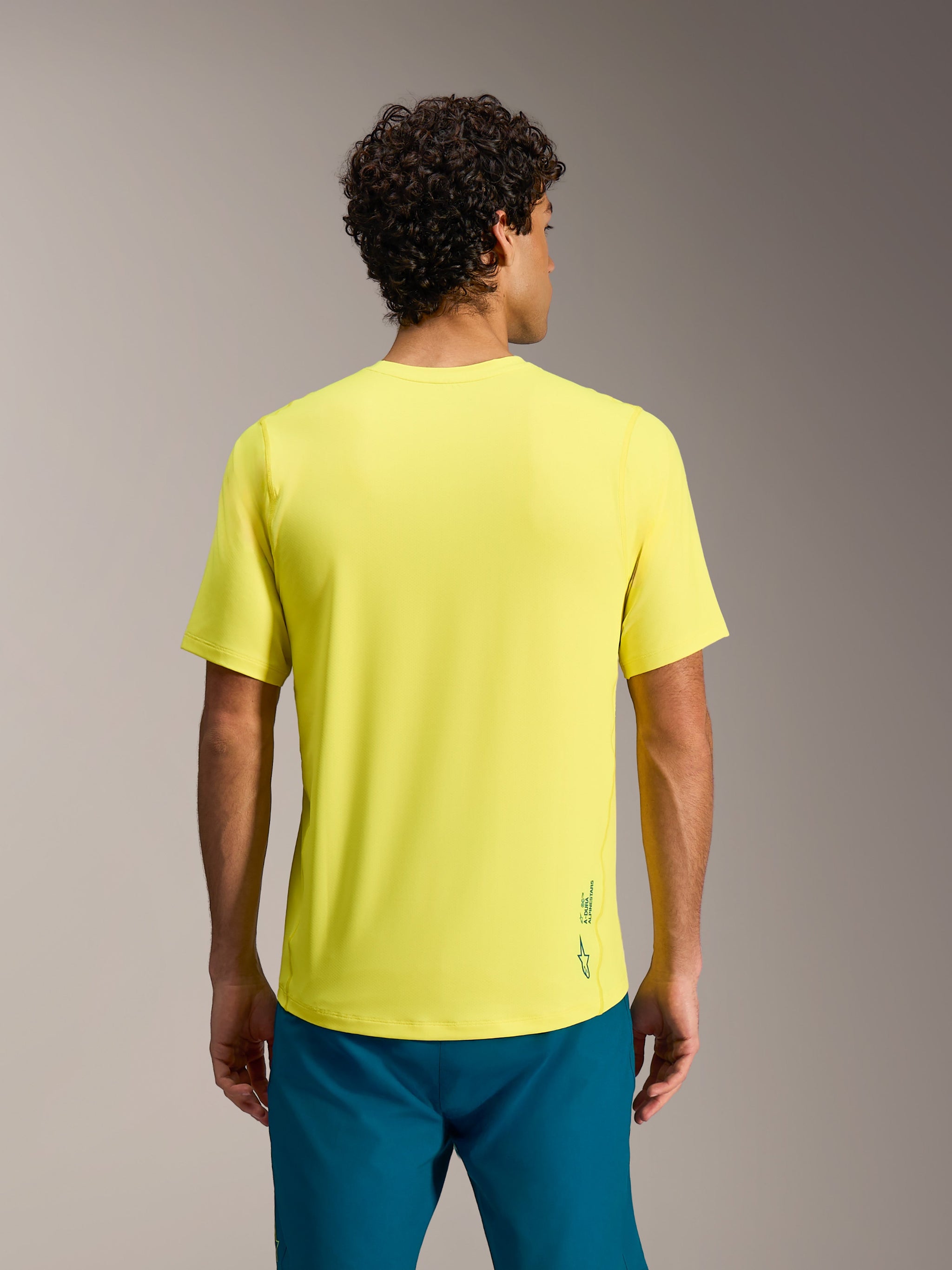 A-Dura Ride Short Sleeve Jersey in Yellow Fluo, featuring a regular fit and Astars branding on the lower back, rear view.