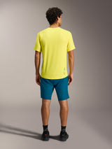 Yellow A-Dura Ride SS Jersey paired with blue-green A-Dura Ride Shorts, seen from behind for MTB performance apparel.