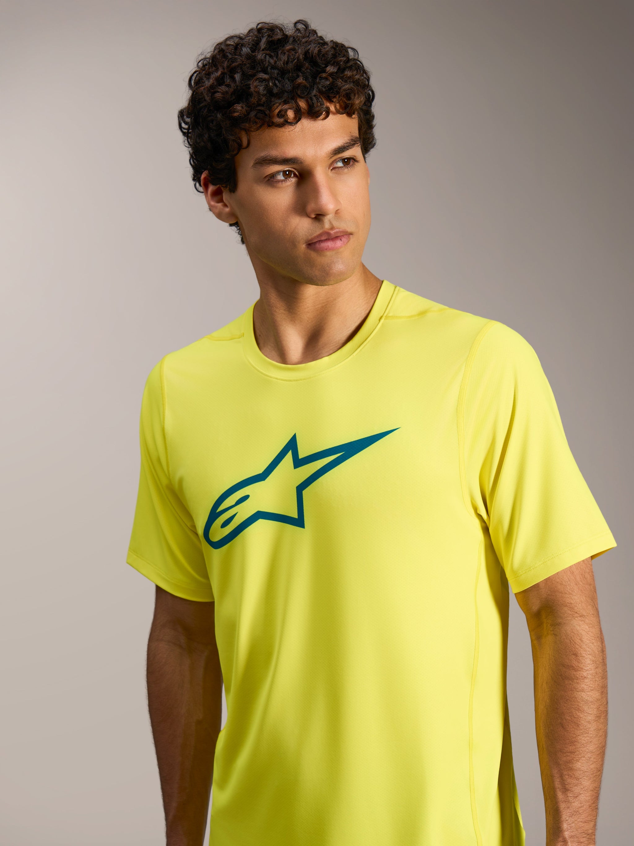 A-Dura Ride Short Sleeve Jersey in Yellow Fluo, featuring a teal Astars chest logo, designed for performance MTB.