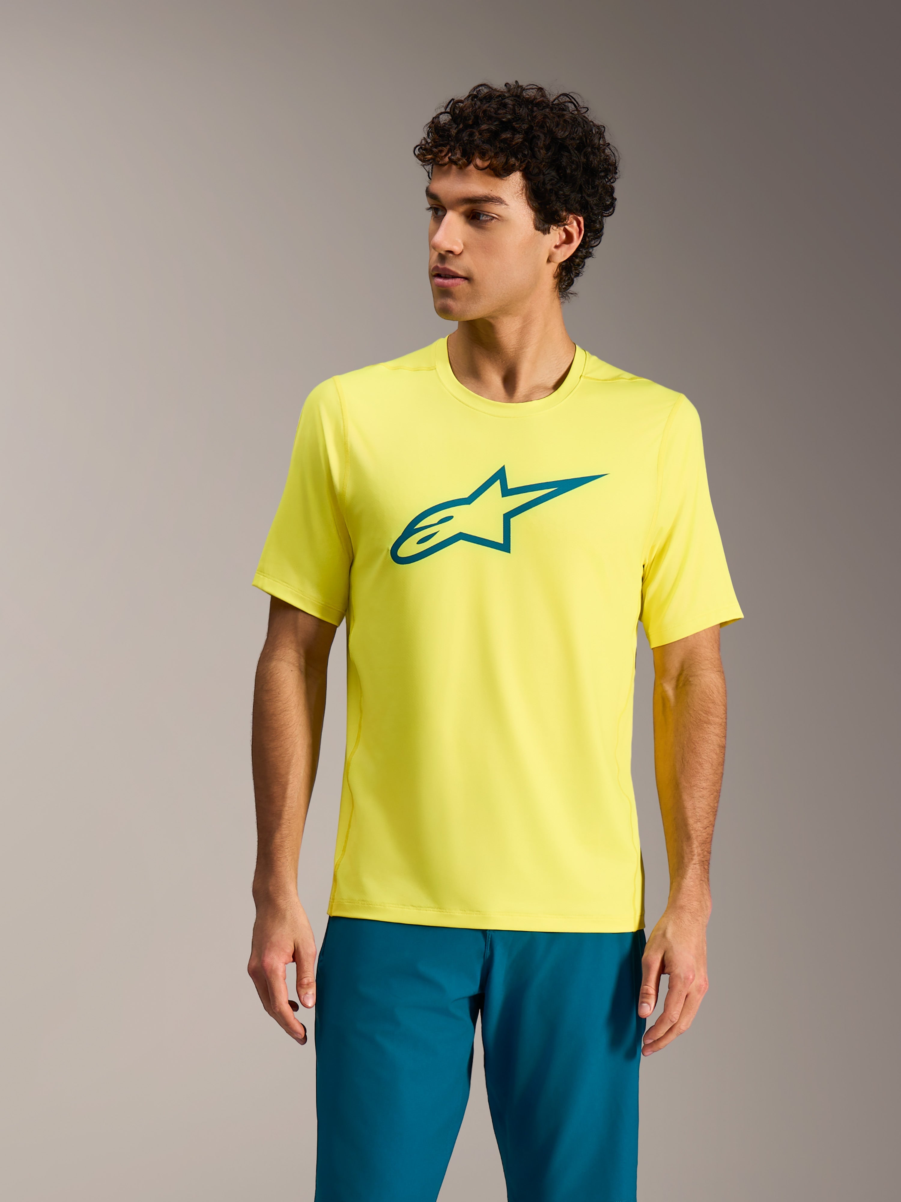 Alpinestars A-Dura Ride Trikot in Yellow Fluo, Kurzarm-MTB-Top mit petrolfarbenem Logo, Performance-Radbekleidung.