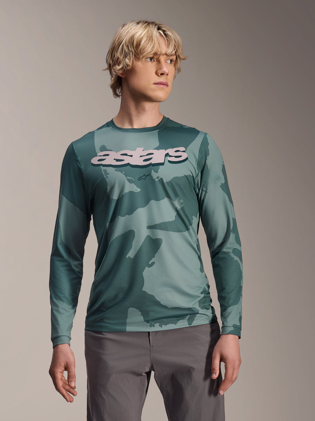 Alpinestars A-Dura Hollow Camo Long Sleeve Jersey, MTB Jersey, Silver Pine Camo green camouflage pattern, large light grey astars logo on chest, worn with grey pants, high-performance mountain biking apparel
