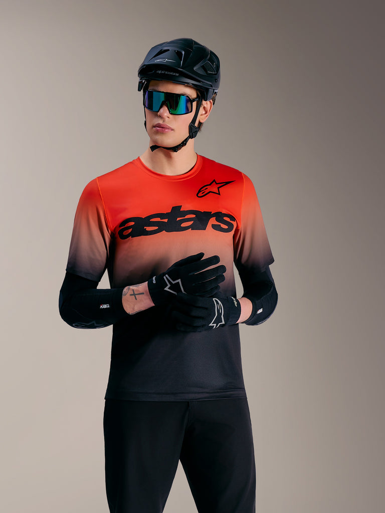 A-Dura ASTARS Jersey 2.0, short sleeve MTB top in orange and black gradient with bold wordmark and logo graphics.