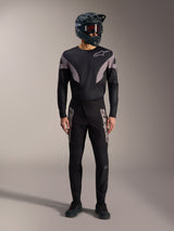 Black A-Supra Elite MTB kit featuring a long-sleeve jersey and racing pants with grey logos and a full-face helmet.