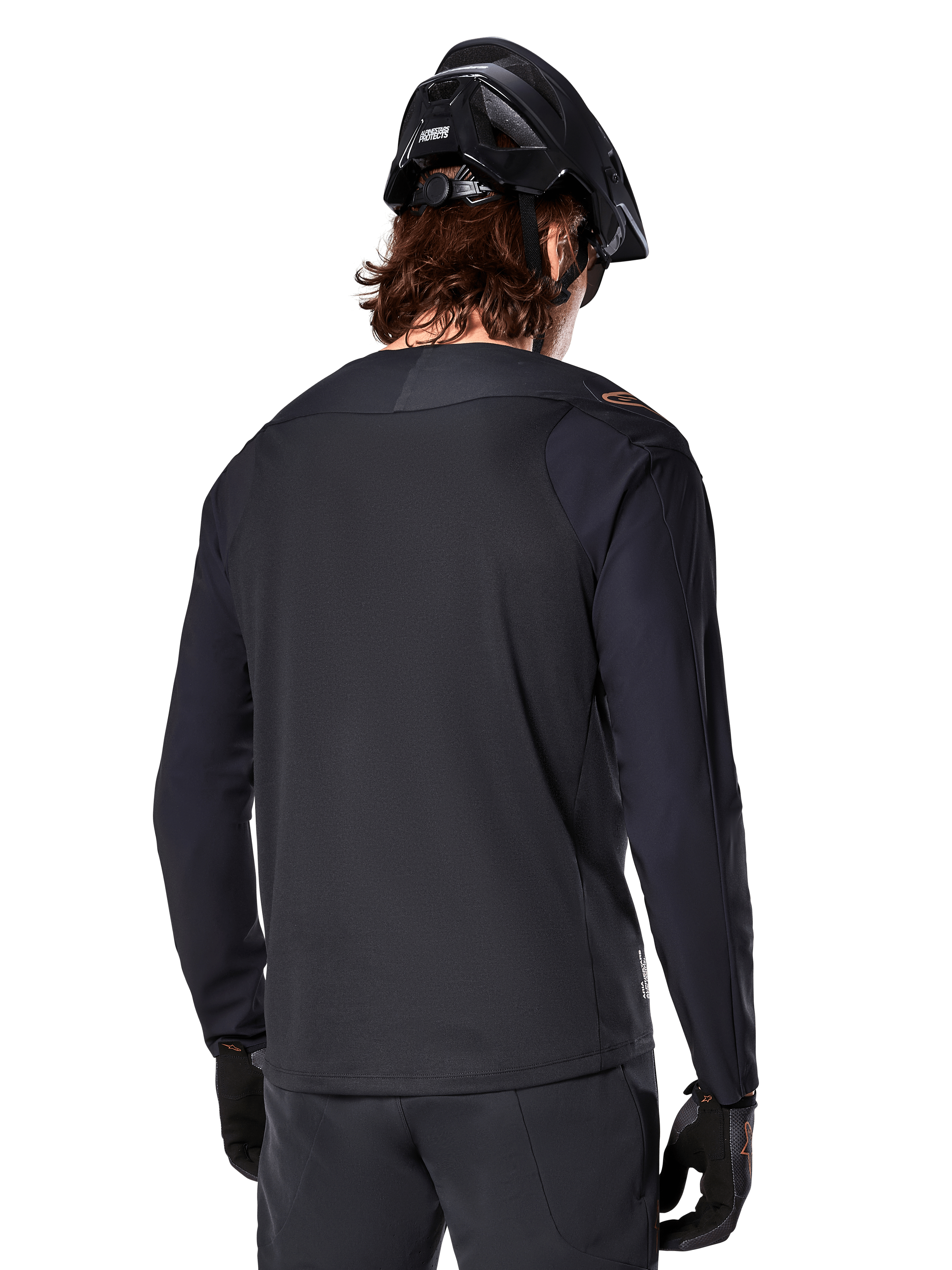Alpinestars A-Aria Polartec Switch Jersey - Long Sleeve, Black, back view, worn with a black MTB helmet and gloves, featuring a drop tail design for off-road performance