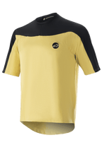 Alpinestars Drop Meta Trikot – Kurzarm, MTB-Fahrradtrikot, Gold und Schwarz, Mesh-Konstruktion mit farblich abgesetzten Schulterpartien, kreisförmiges Brustlogo und verlängerter Rücksaum.