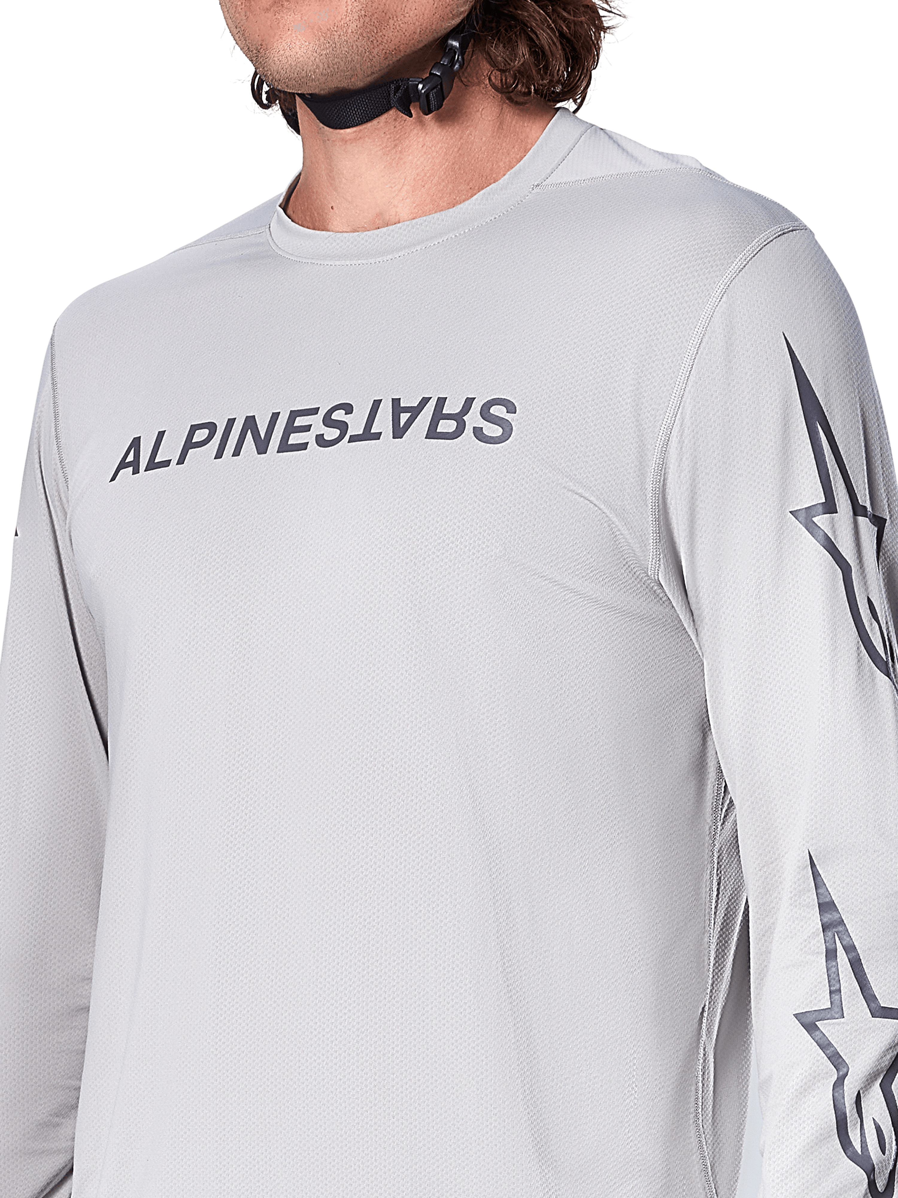 Alpinestars A-Dura Switch Jersey – Langarm, hellgraues Mountainbike-Trikot mit dunkelgrauem Schriftzug auf der Brust und Stern-Logo auf dem Ärmel, atmungsaktive Jacquard-Struktur, Performance-Radsportbekleidung für Trailfahrten