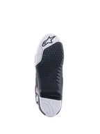 Alpinestars Tech 10 Supervented Boots, Motocross Boots, bottom sole view, black honeycomb grip pattern on white and black base, replaceable central insert, featuring the Alpinestars logo on the toe