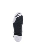 Alpinestars Tech 10 Supervented Boots, White and Black sole view, featuring an extended honeycomb grip design, black replaceable central insert, white toe with Alpinestars star logo, optimized for motocross footpeg control.