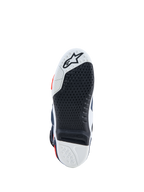 Alpinestars Tech-10 Supervented motocross boots, black and white sole featuring a replaceable high-grip center insert.
