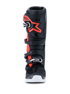 Alpinestars 2026 Tech 7 Enduro Drystar® Boots, Motocross and Enduro Boots, Black Red Fluo and White, front view, featuring a four-buckle closure system, reinforced TPU shin plate with a large red Alpinestars logo, and white outsole, engineered for waterproof off-road performance.