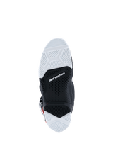 Alpinestars 2026 Tech 7 Enduro Drystar® Boots, bottom sole view, black and white double-density rubber compound, textured geometric grip patterns, Alpinestars logo and wear limit indicator, designed for off-road and enduro traction