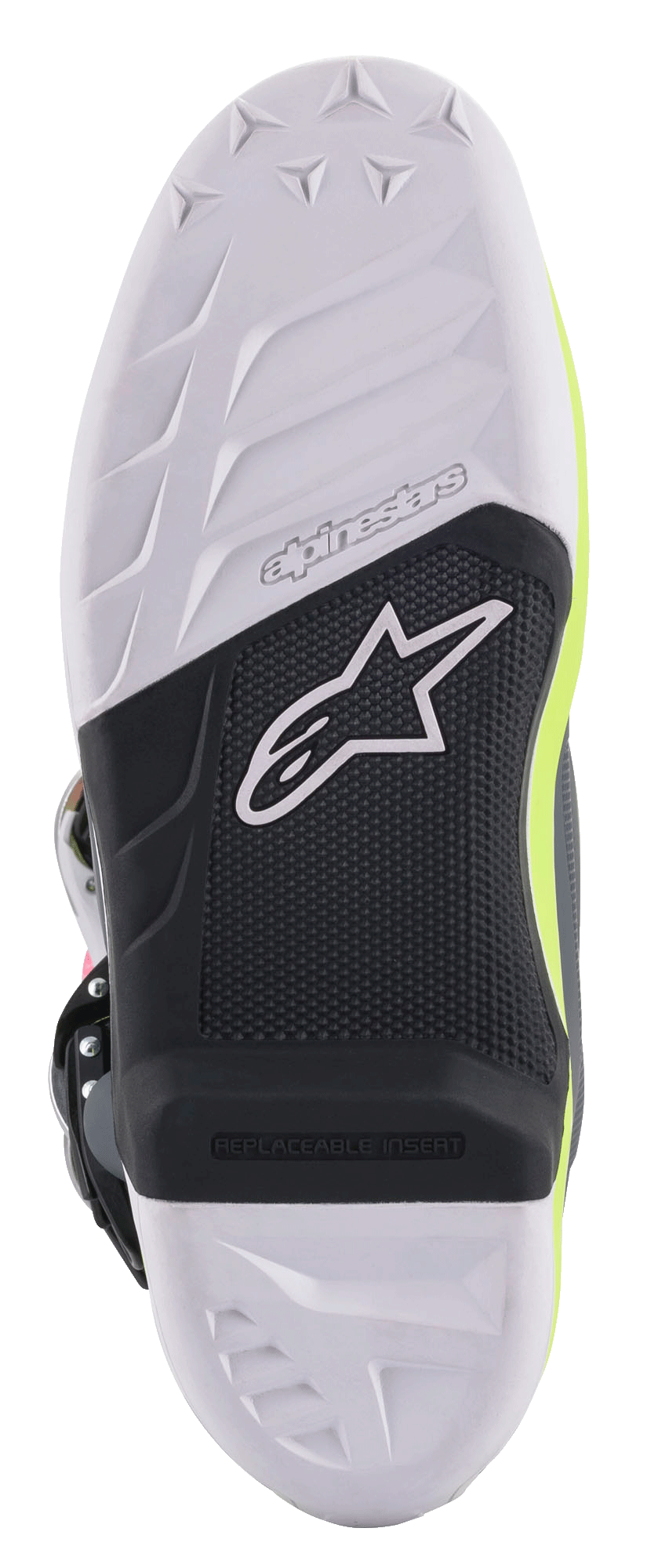 Alpinestars Tech 7 Stiefel, Motocross-Stiefel, Detailansicht der Sohle mit einem schwarz-weißen Verbunddesign, austauschbarer Fußrasteneinsatz, strukturierter Grip mit dem Alpinestars Stern-Logo und fluoreszierend gelben Akzenten