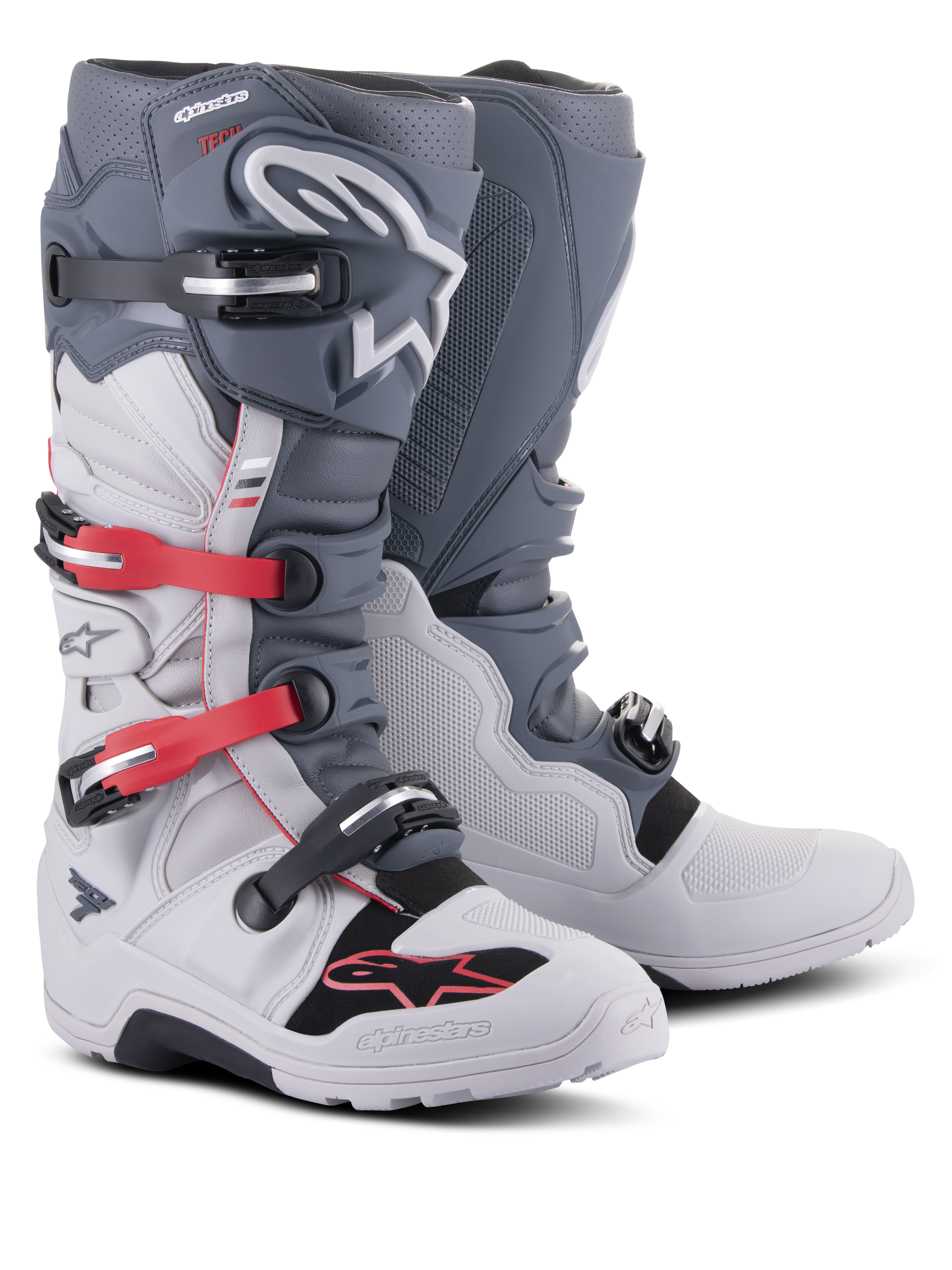 Alpinestars Tech 7 Enduro Boots, off-road motorcycle footwear, Light Gray and Dark Gray with Bright Red accents, featuring a multi-buckle closure system and a rugged compound sole designed for enduro and trail riding.