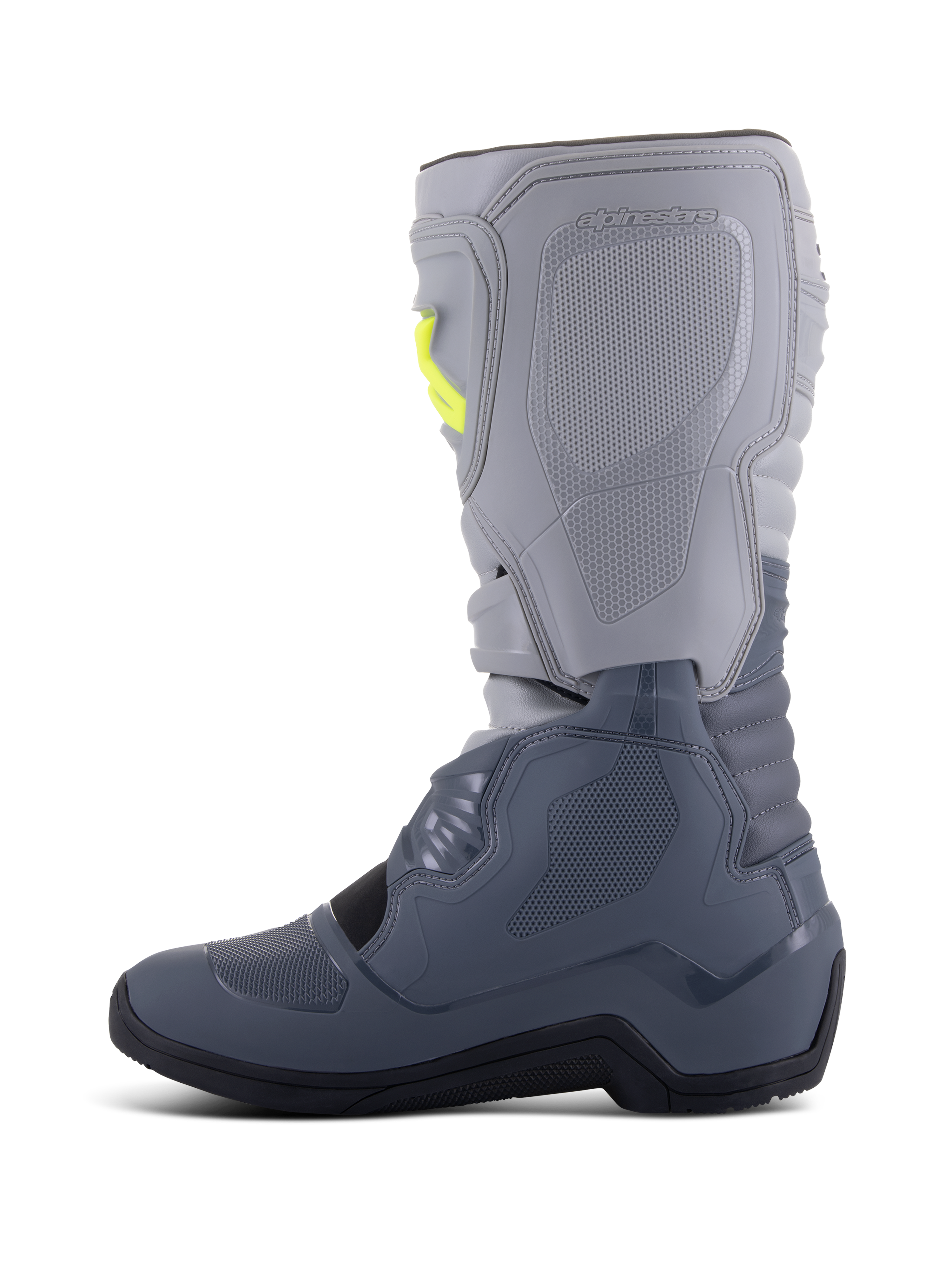 Alpinestars Tech 3 Stiefel, Motocross-Stiefel, Dunkelgrau, Hellgrau und Schwarz, Seitenansicht mit hellgrauem Oberteil und dunkelgrauem Unterteil sowie gelben Schnallenakzenten, TPU-Schutzplatten und strapazierfähiger schwarzer Sohle.