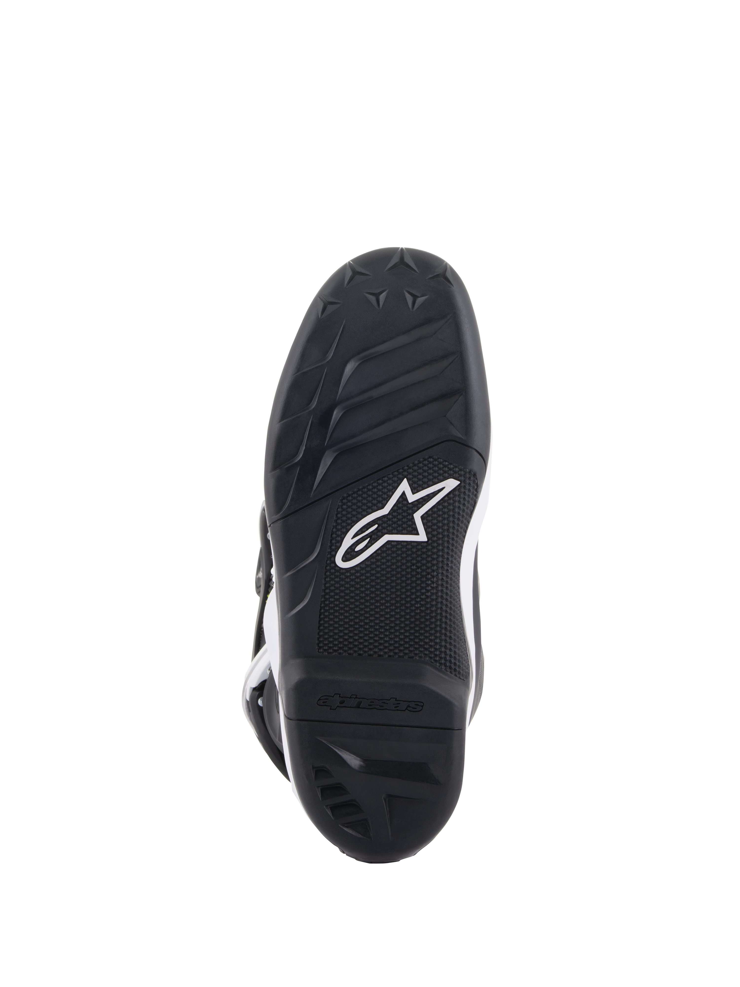 Alpinestars Youth Tech 7S Stiefel, Ansicht der Sohle, schwarzer Gummi mit strukturiertem Profilmuster und weißem Alpinestars-Logo, langlebige Verbundkonstruktion für Jugend-Motocross.