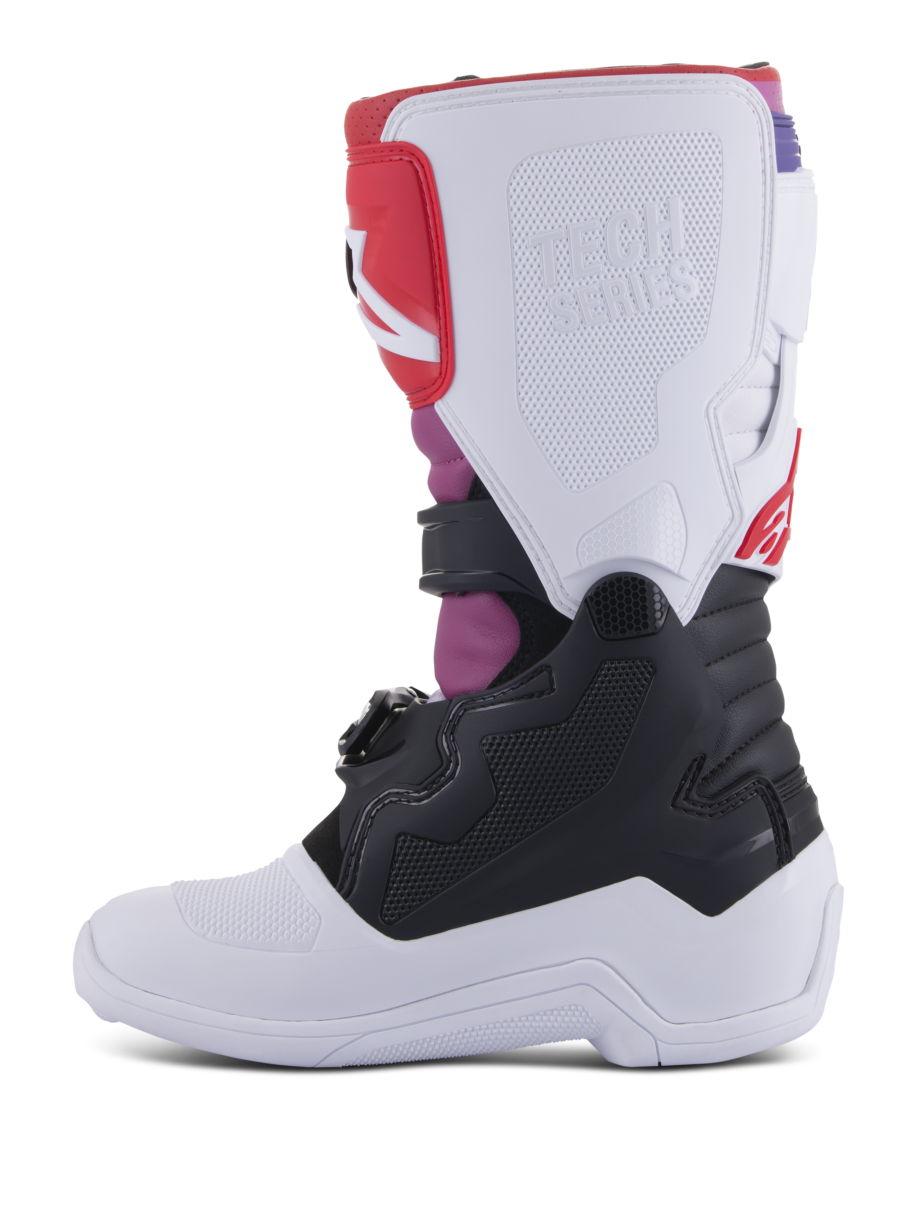 Alpinestars Youth Tech 7S Stiefel, Motocross-Stiefel, White Black Rainbow, mediale Seitenansicht mit weißer Schienbeinplatte und geprägtem Tech Series-Logo, schwarzem unteren Bereich und leuchtend pinken und roten Akzenten, strapazierfähige Schutzausrüstung für jugendliche Offroad-Fahrer