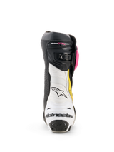 Alpinestars Supertech R Stiefel, Motorrad-Rennstiefel, Schwarz, Magenta, Weiß und Gelb Fluo, Rückansicht mit weißer Fersenkappe und schwarzem Branding, weißer Akkordeon-Flexzone und schwarzem Obermaterial mit pinken und gelben Akzenten
