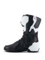 Alpinestars Stella SMX-6 V3 Drystar® Stiefel, Performance-Motorradstiefel für Damen, Weiß und Schwarz, mediale Seitenansicht mit geprägtem Drystar-Branding, weißem TPU-Schienbein- und Fersenschutz sowie geschmeidigem schwarzem Mikrofaser-Obermaterial für Performance auf Rennstrecke und Straße.