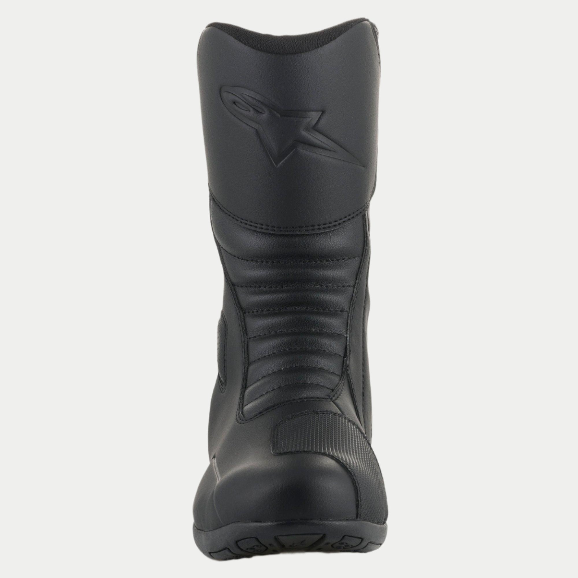 Alpinestars Origin Drystar® Stiefel, schwarze Motorrad-Tourenstiefel, Vorderansicht mit Akkordeon-Flexzonen, geprägtem Logo auf dem Schienbein und strapazierfähiger Mikrofaser-Konstruktion mit synthetischem Schaltpolster.