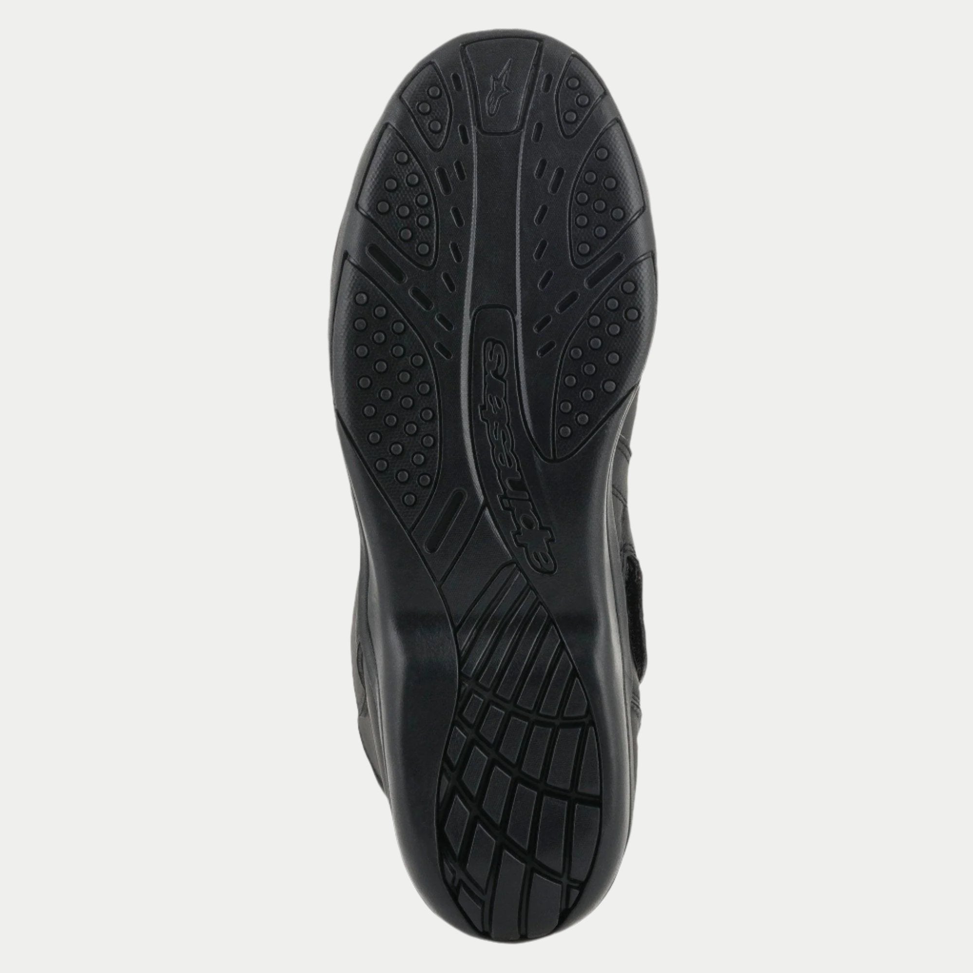 Alpinestars Origin Drystar® Stiefel, Schwarz, Detailansicht der Gummiaußensohle, strukturiertes Profilmuster mit eingeprägtem Logo, strapazierfähige Sohle für Motorradtouren