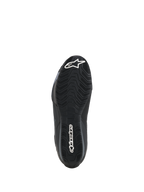 Alpinestars Celer Shoes, bottom sole view, black oil-resistant rubber compound with textured wavy grip pattern, featuring white Alpinestars branding on the toe and heel, designed for motorcycle footpeg traction.