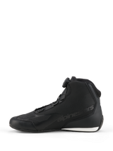 Alpinestars Celer Shoes, Motorcycle Riding Shoes, Black and White, side profile featuring the Rotor Closure System dial, sleek microfiber construction with embossed logo and white contrast on the heel.