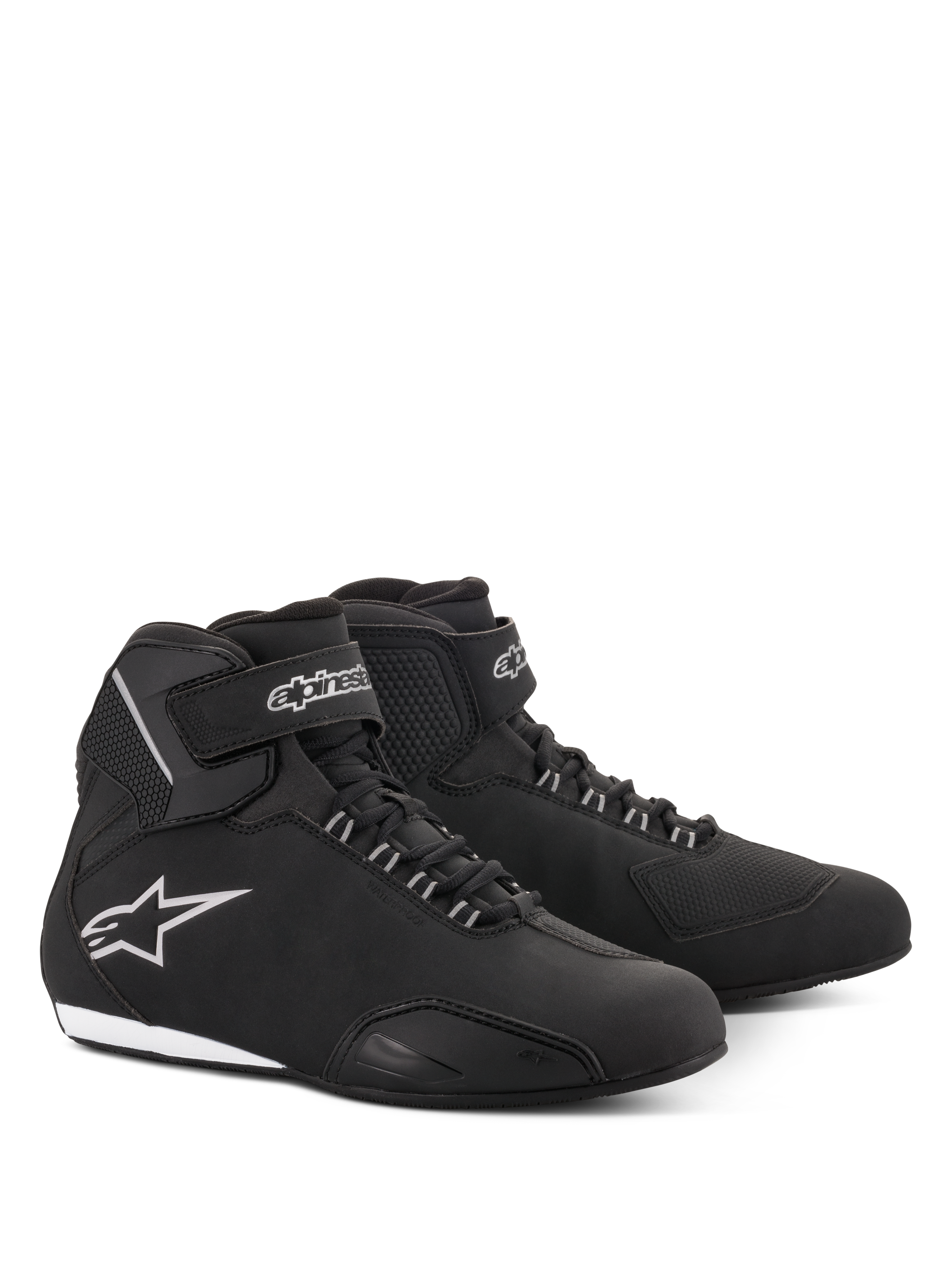 Alpinestars Women Stella Sektor Waterproof Shoes, Motorcycle Riding Shoes, Black and Silver, sleek microfiber upper with lace-up closure and velcro ankle strap, featuring a silver Alpinestars star logo on the side and a slim rubber sole.