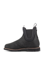 Alpinestars Turnstone Schuhe, schwarzer Motorradstiefel im Chelsea-Stil, Seitenansicht, gefertigt aus 1,5 mm Rindsleder mit elastischen Knöcheleinsätzen und Zuglaschen vorne und hinten.