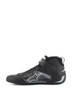 Alpinestars Tech-1 Z V3 Shoes FIA, Auto Racing Shoes, Black and Silver, side profile view, premium bovine leather upper with a large silver stylized star logo, velcro ankle strap, and sleek high-top design for professional motorsport performance.