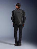 Alpinestars GP Plus R V4 Airflow Leather Jacket, Black, back view of rider wearing complete gear, features perforated leather for ventilation and red logo accents, sleek sport-fit design, paired with black pants and riding boots