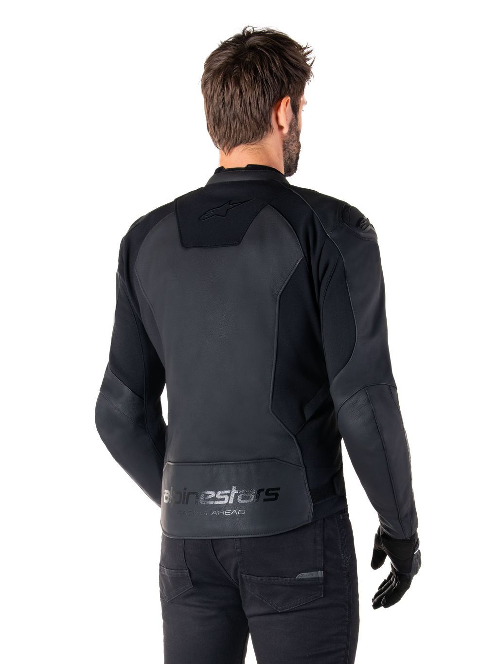 Alpinestars Faster V3 Leather Jacket, Black Black, Rear view of model wearing the sport riding jacket, featuring 'alpinestars' and 'RACING AHEAD' branding on the lower back, premium leather with matte panels, modern sport silhouette for motorcycle riding