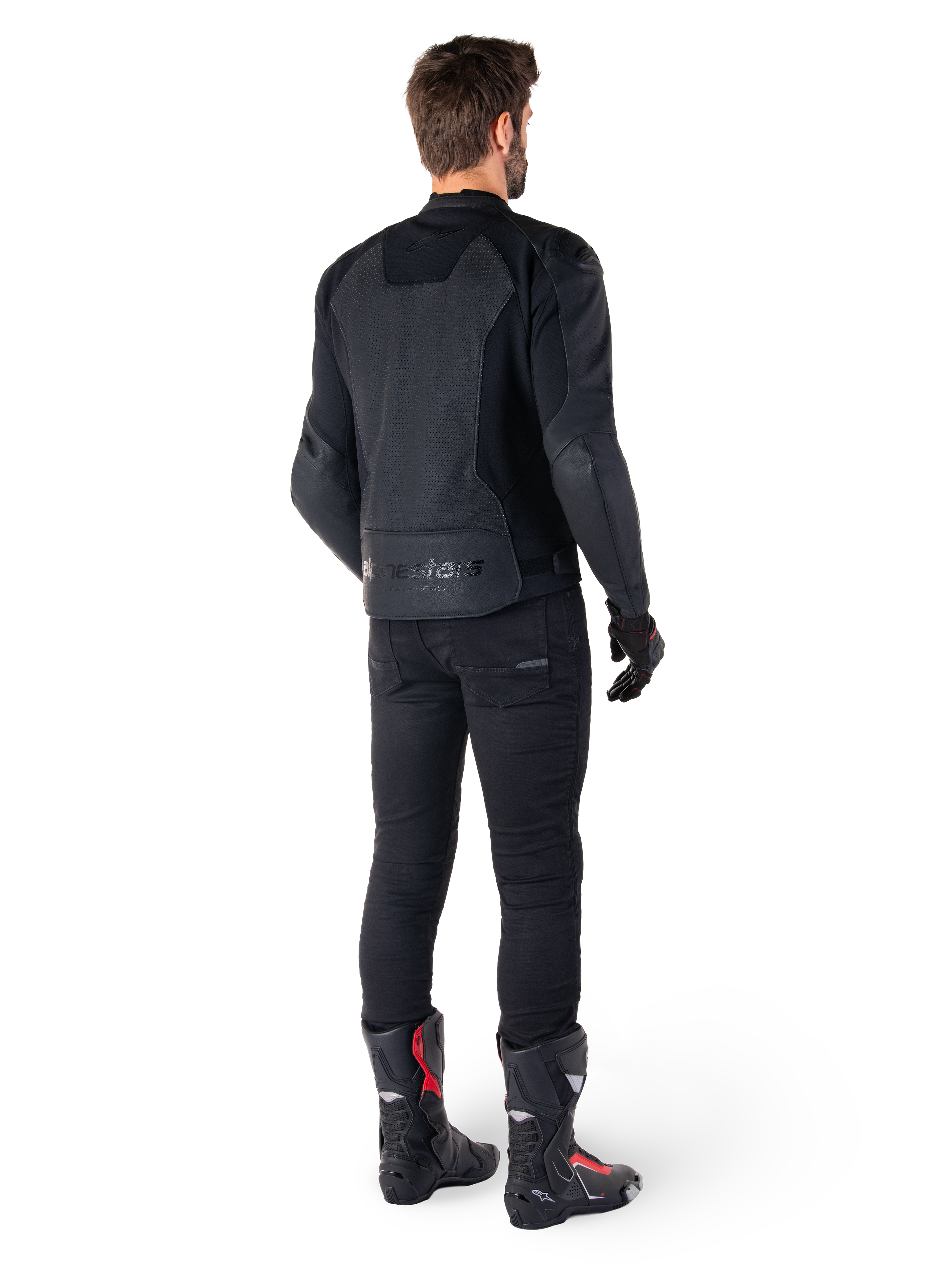 Alpinestars Faster V3 Airflow Leather Jacket, Black, Rear view of a man wearing a sport leather jacket with perforated back panels and Alpinestars branding, styled with black riding pants and black and red boots.