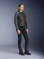 Alpinestars Stella Dyno Leather Jacket, Women's Motorcycle Jacket, Black Tar Gray and Dark Gray, worn with black riding pants and boots, featuring grey racing stripes on sleeves and heritage leather design