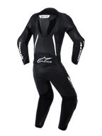 Alpinestars Woman Stella GP-R7 2-Piece Leather Suit, back view in Black with white accents, featuring an integrated aerodynamic hump, accordion stretch panels on shoulders and lower back, perforated leather for ventilation, and prominent Alpinestars branding.