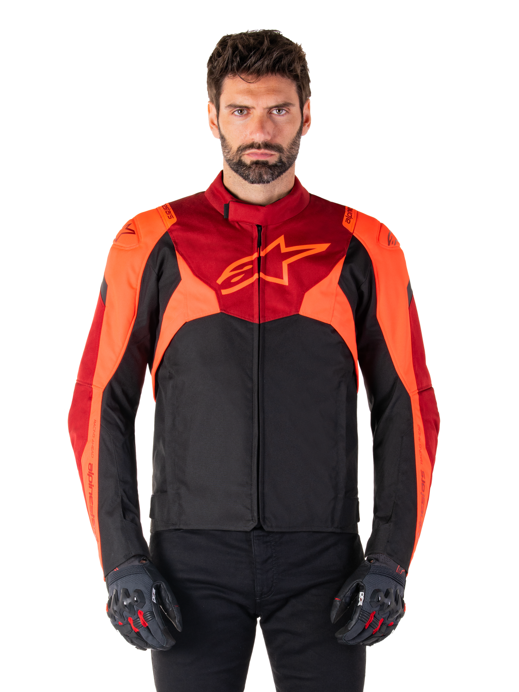 Alpinestars T-Jaws V4 Waterproof Jacket, Sport Textile Motorcycle Jacket, Black with Red Fluo and Dark Red accents, worn by a male model with matching gloves, technical riding gear with prominent star logo on the chest.