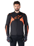 Alpinestars T-Jaws V4 Waterproof Jacket, Motorcycle Sport Jacket, Black and Red Fluo, featuring neon accents and a prominent star logo on the chest, worn by a male model with black riding gloves, sleek racing-inspired textile design