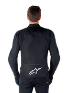 Alpinestars T-Jaws V4 Waterproof Jacket, Motorcycle Jacket, Black Dark Blue Blithe Blue, back view on a model, featuring a large white Alpinestars logo on the lower back, dark blue shoulder accents, and a sleek sport silhouette.