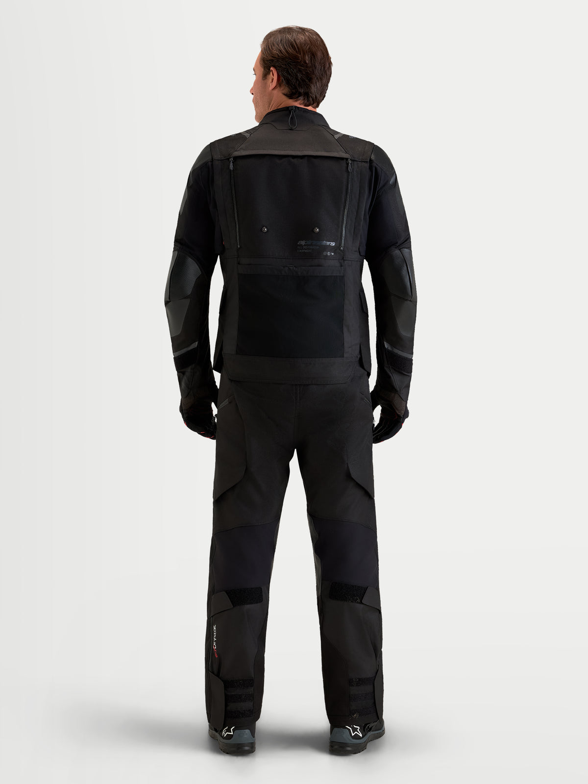 Alpinestars Harok V2 Drystar Gear Set, men's waterproof motorcycle touring jacket and pants in black, rear view on a model wearing full protective all-weather riding apparel