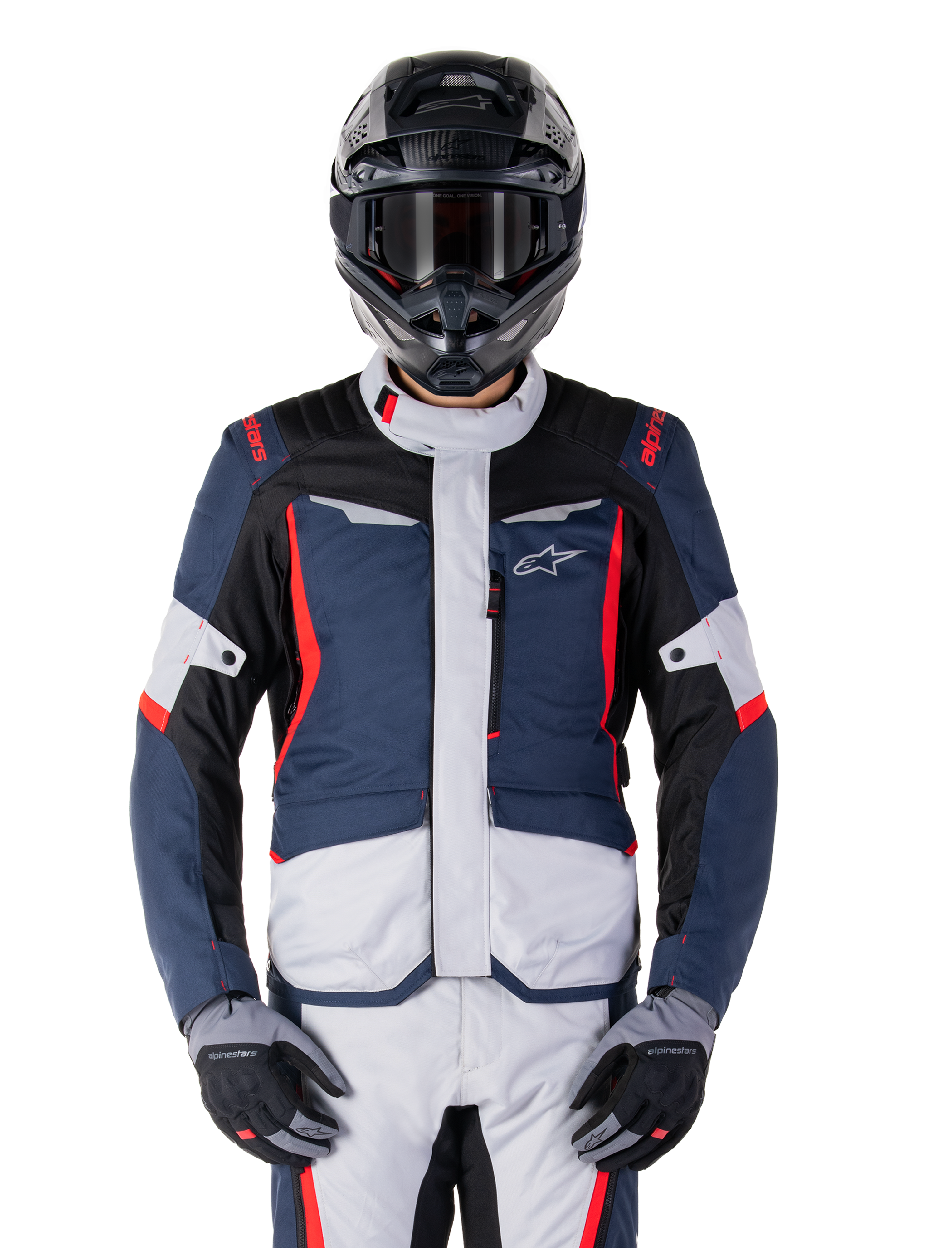 Alpinestars ST-1 Waterproof Jacket, Motorcycle Adventure Touring Jacket, Dark Blue and Black with Light Grey panels and Bright Red accents, worn with matching pants and black helmet, featuring star logo on chest and durable textile construction