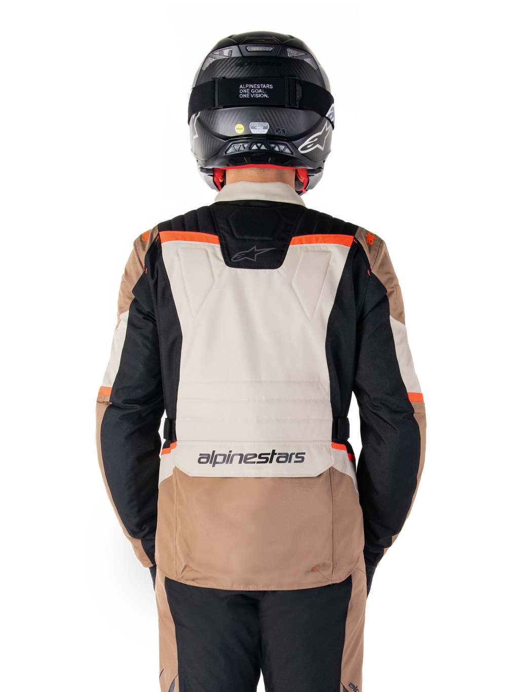 Alpinestars ST-1 Waterproof Jacket, Dark Khaki Sand Black Red Fluo, Rear view, adventure touring motorcycle jacket featuring a large sand-colored back panel, black sleeves, and red fluorescent accents, shown on a rider with a black helmet.