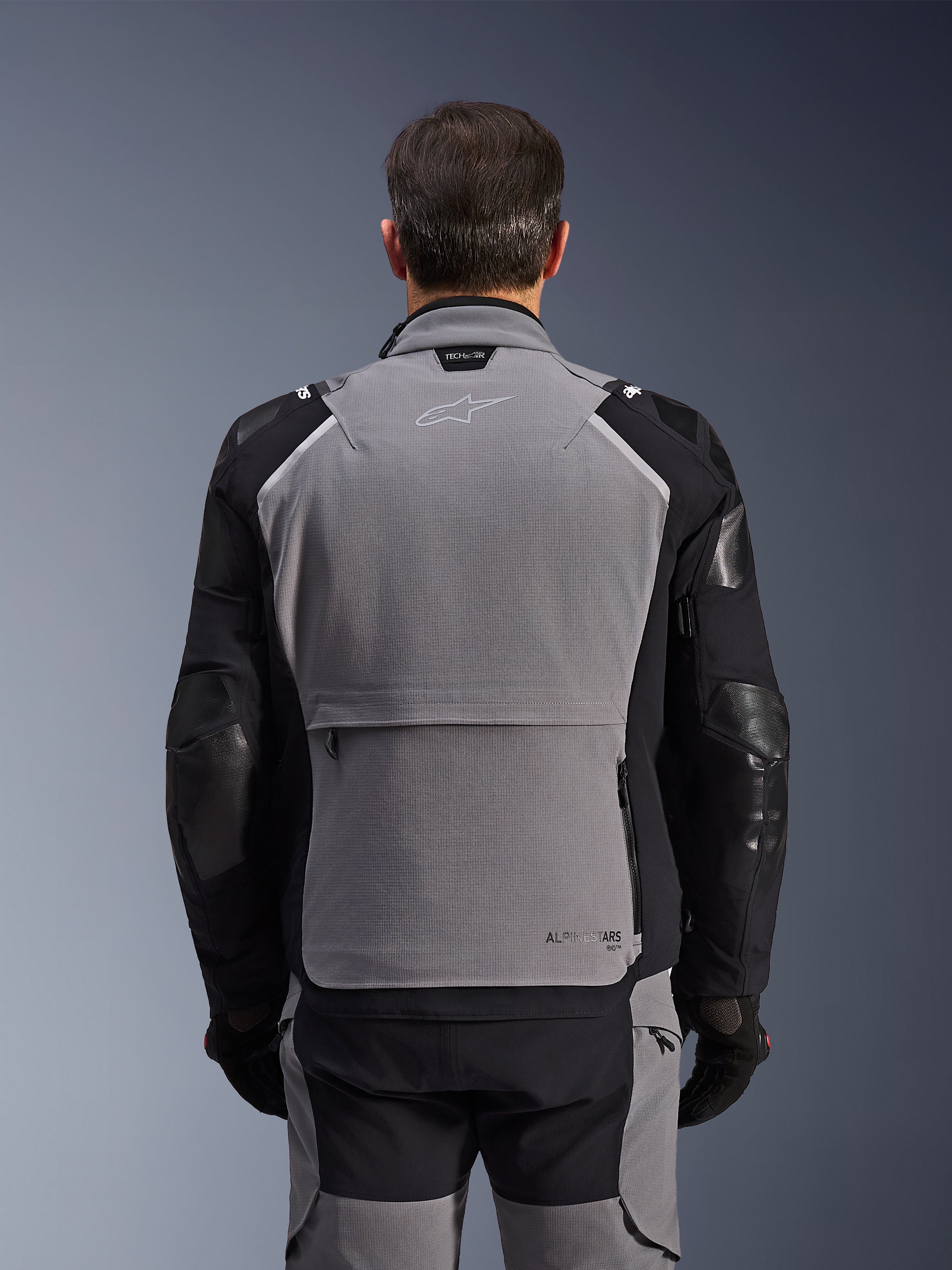 Alpinestars Andes Pro Drystar® XF Jacket, Rear View, Dark Gray and Black, adventure touring jacket featuring a large rear storage pocket, Tech-Air® Ready branding on the collar, and reinforced elbow panels.