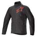 Alpinestars Hyde XT Drystar XF Jacke, technische Motorradjacke in Schwarz und leuchtendem Rot, großes rotes Stern-Logo auf der Brust, vertikale Belüftungsreißverschlüsse an der Brust, hoher Kragen, texturiertes Vier-Wege-Stretchgewebe, entwickelt für Adventure- und Offroad-Fahrten