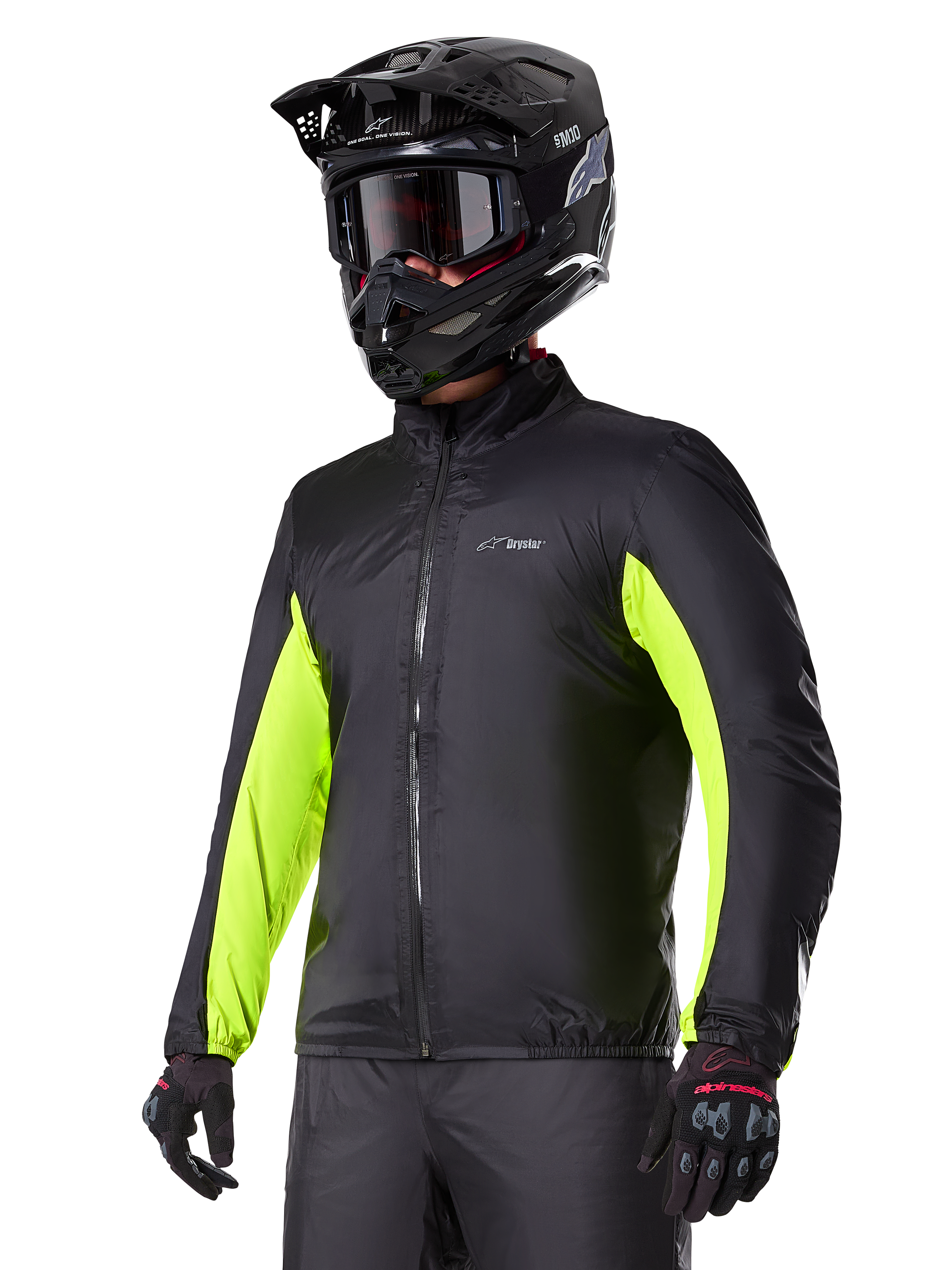 Alpinestars Bogotá Pro Drystar® Jacket waterproof liner, black with bright yellow fluo accents on the sleeves, worn by a rider with a black helmet and goggles, technical motorcycle apparel.