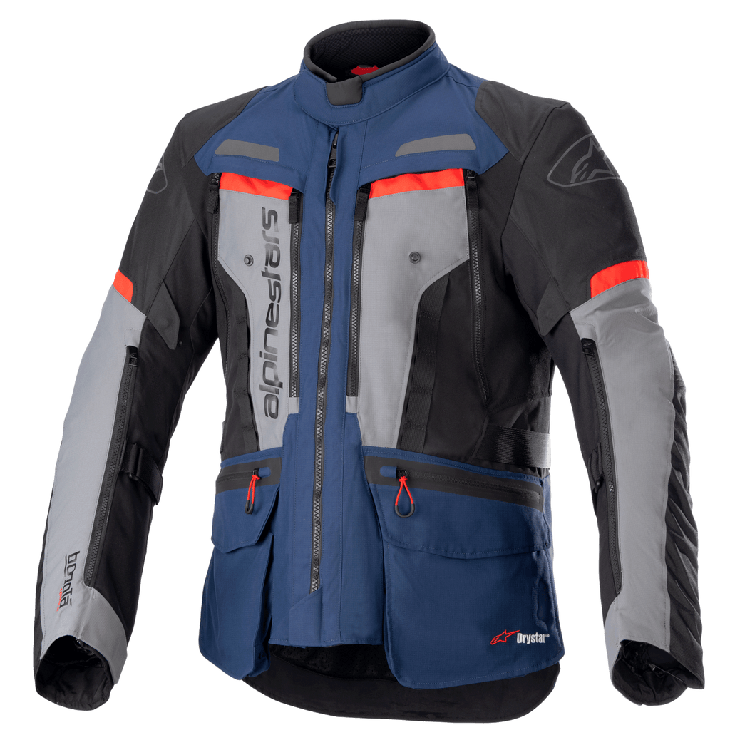 Alpinestars Bogota Pro Drystar Jacket, motorcycle adventure touring jacket, Dark Blue and Black with Gray chest panels and Bright Red accents, featuring waterproof textile construction, multiple ventilation zippers, and utility pockets.