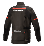 Alpinestars Honda Andes V3 Drystar® Jacke, Schwarz, Rückansicht mit weißem Honda und Alpinestars Branding, roten Akzentstreifen an den Schultern und Ärmeln, Adventure-Touren-Motorradjacke mit reflektierenden Details und einer großen Rückentasche.
